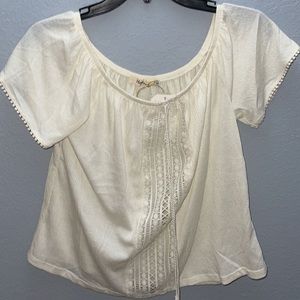 white short sleeve with tassel